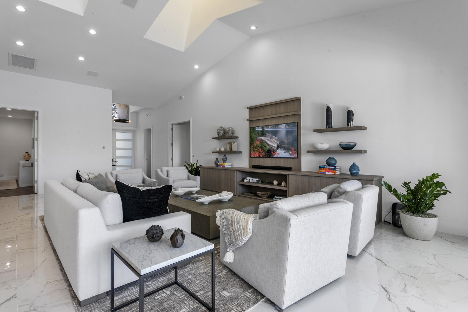 245 Regatta Drive Jupiter, FL 33477 - Photo 9 of 51 a living room with furniture and a potted plant
