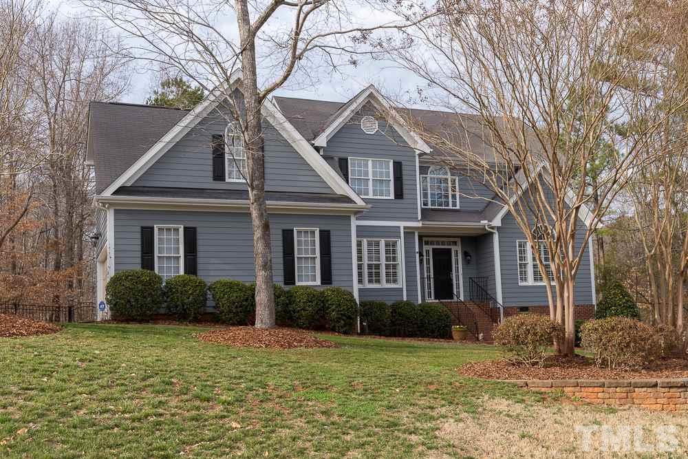 2921 Sunnystone Way Raleigh, NC 27613 - Photo 1 of 25 a front view of a house with garden