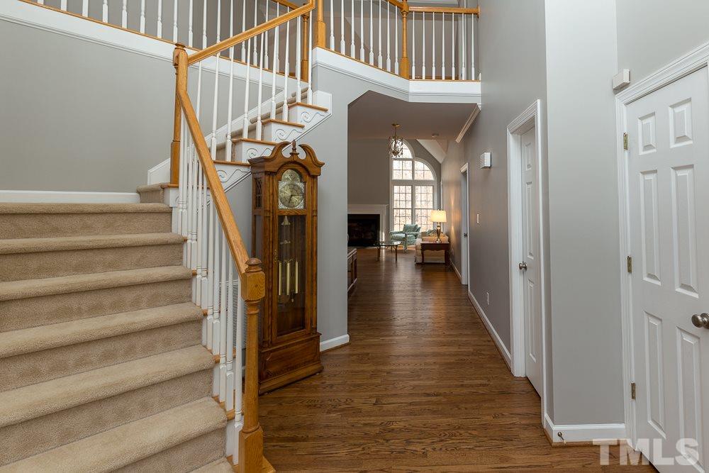2921 Sunnystone Way Raleigh, NC 27613 - Photo 3 of 25 a view of entryway and hall with wooden floor