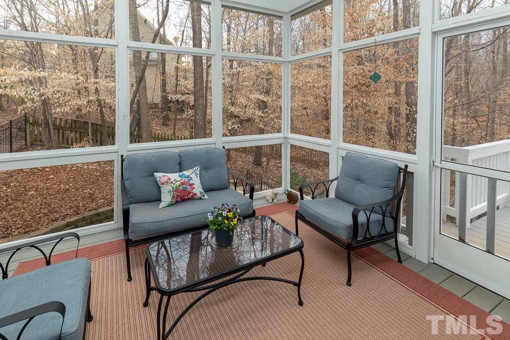 2921 Sunnystone Way Raleigh, NC 27613 - Photo 22 of 25 a outdoor living room with furniture and a window