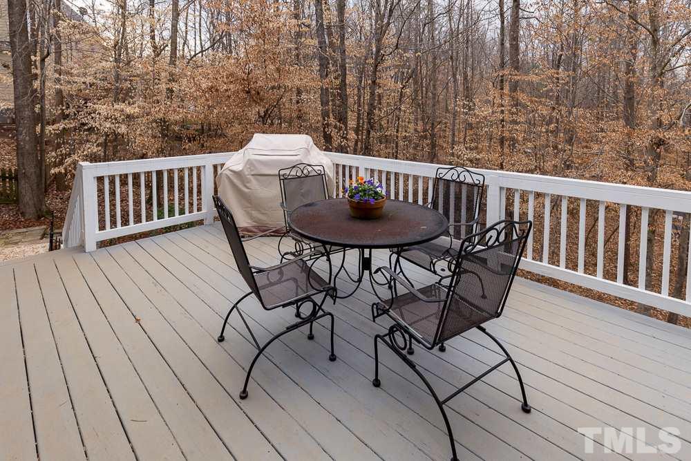 2921 Sunnystone Way Raleigh, NC 27613 - Photo 23 of 25 a view of balcony with wooden floor and outdoor seating