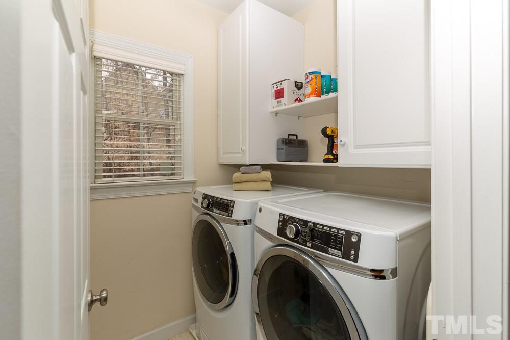 2921 Sunnystone Way Raleigh, NC 27613 - Photo 10 of 25 a utility room with dryer and washer