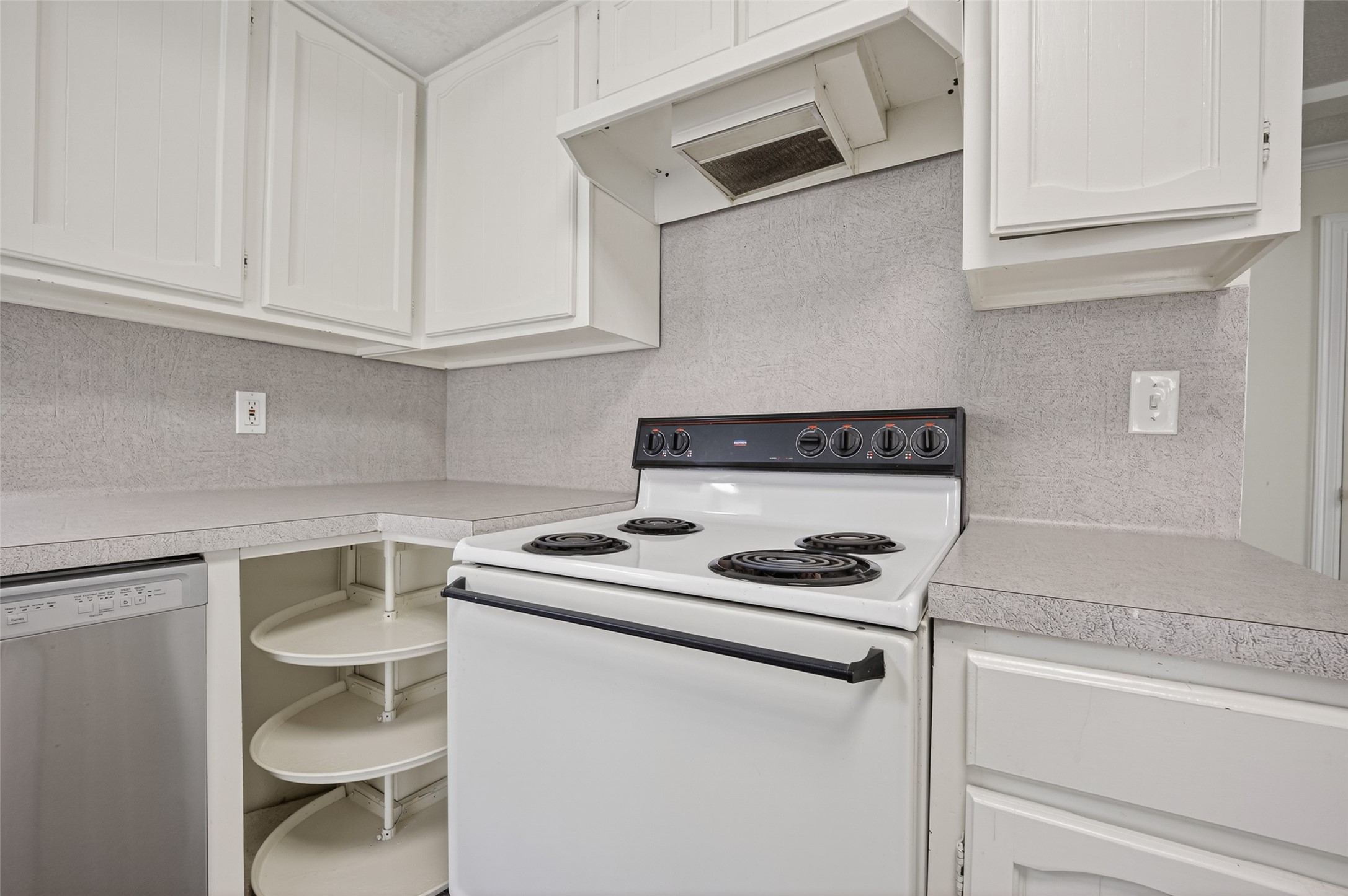 1106 East Red Cedar Circle Spring, TX 77380 - Photo 20 of 43 a white stove top oven sitting inside of a kitchen