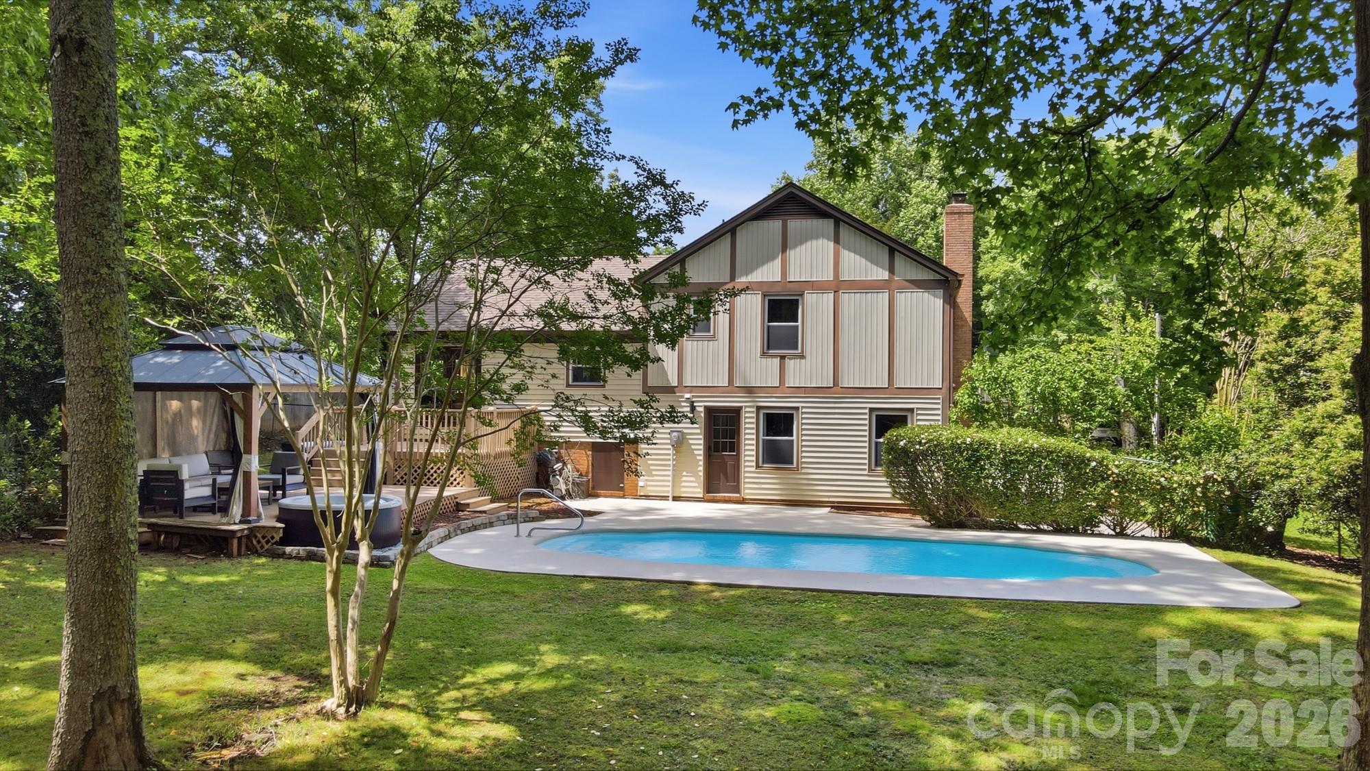 824 Riverwood Road Charlotte, NC 28270 - Photo 29 of 37 a front view of house with yard and green space