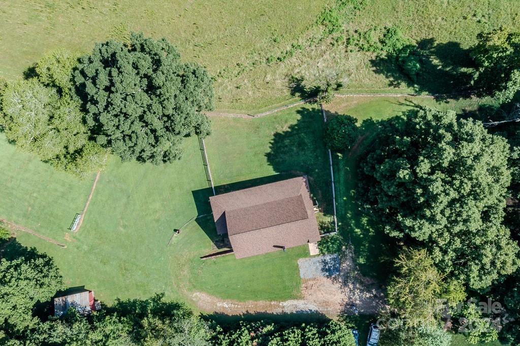 3346 Clarks Chapel Road Lenoir, NC 28645 - Photo 12 of 48 an aerial view of a house with a yard and lake view