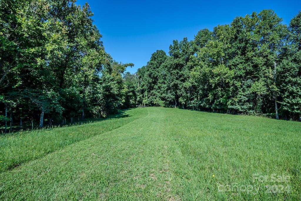 3346 Clarks Chapel Road Lenoir, NC 28645 - Photo 15 of 48 a view of a grassy field with trees