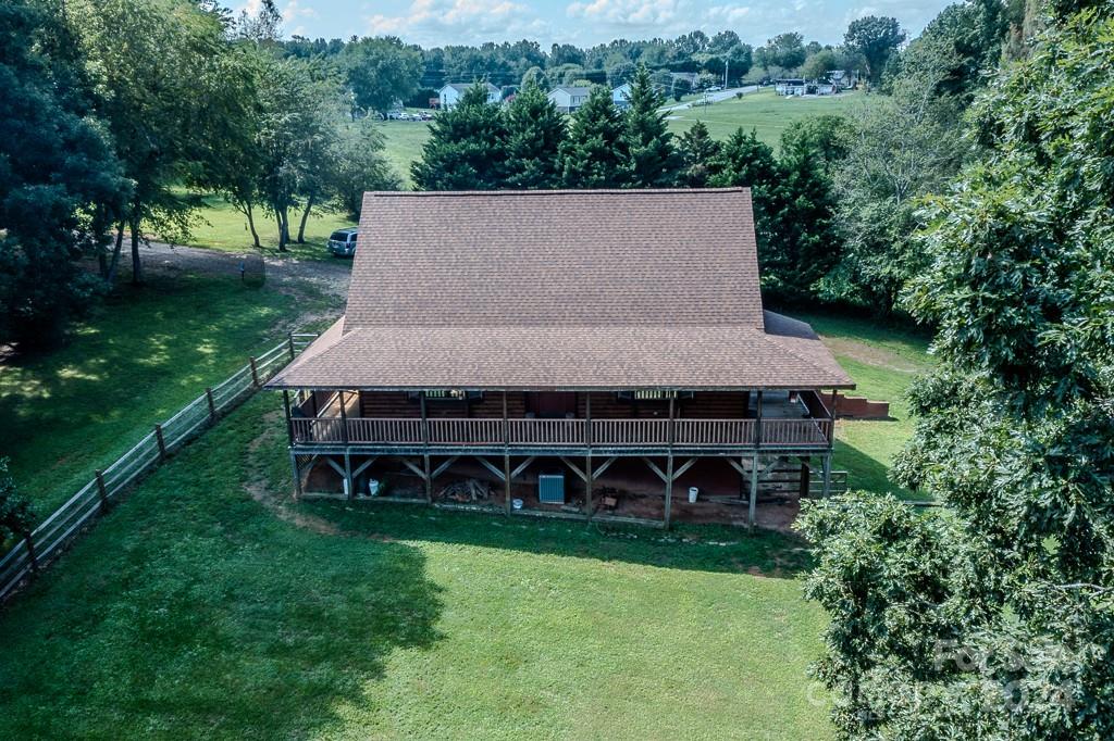 3346 Clarks Chapel Road Lenoir, NC 28645 - Photo 2 of 48 an aerial view of a house with yard and trees in the background