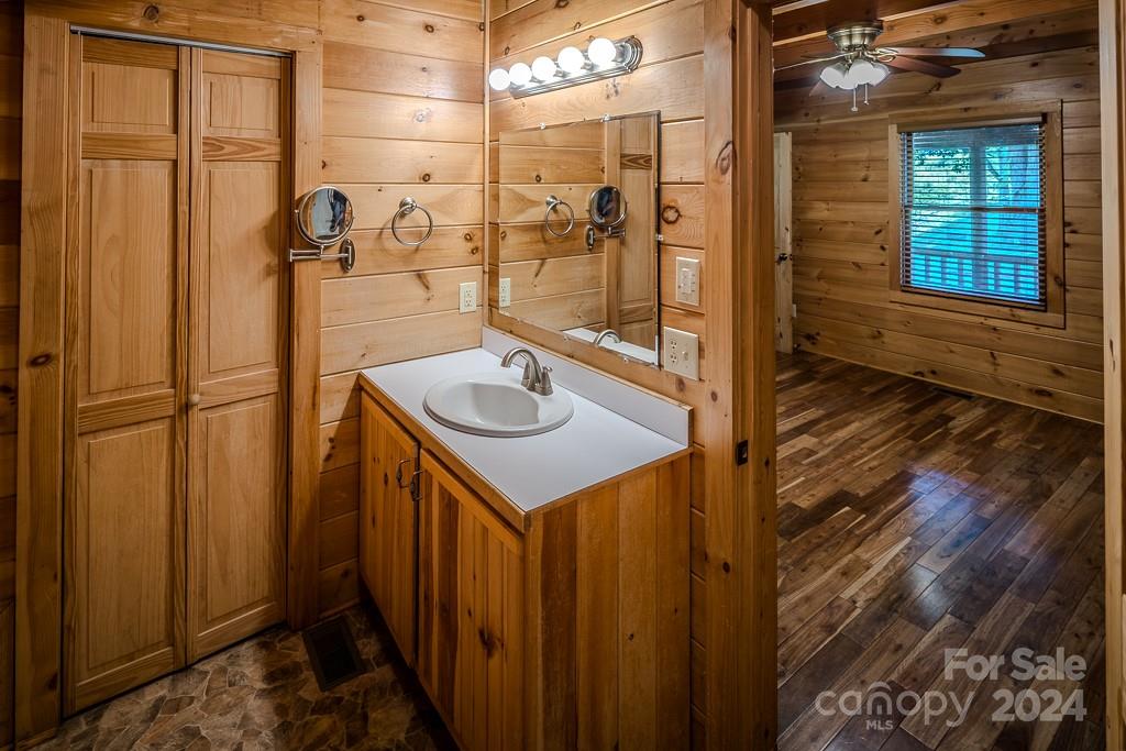 3346 Clarks Chapel Road Lenoir, NC 28645 - Photo 39 of 48 a bathroom with a sink and a mirror