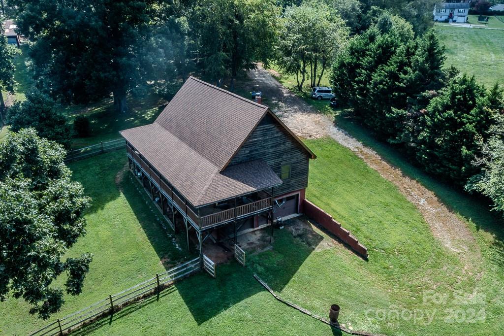 3346 Clarks Chapel Road Lenoir, NC 28645 - Photo 4 of 48 an aerial view of a house with swimming pool and garden