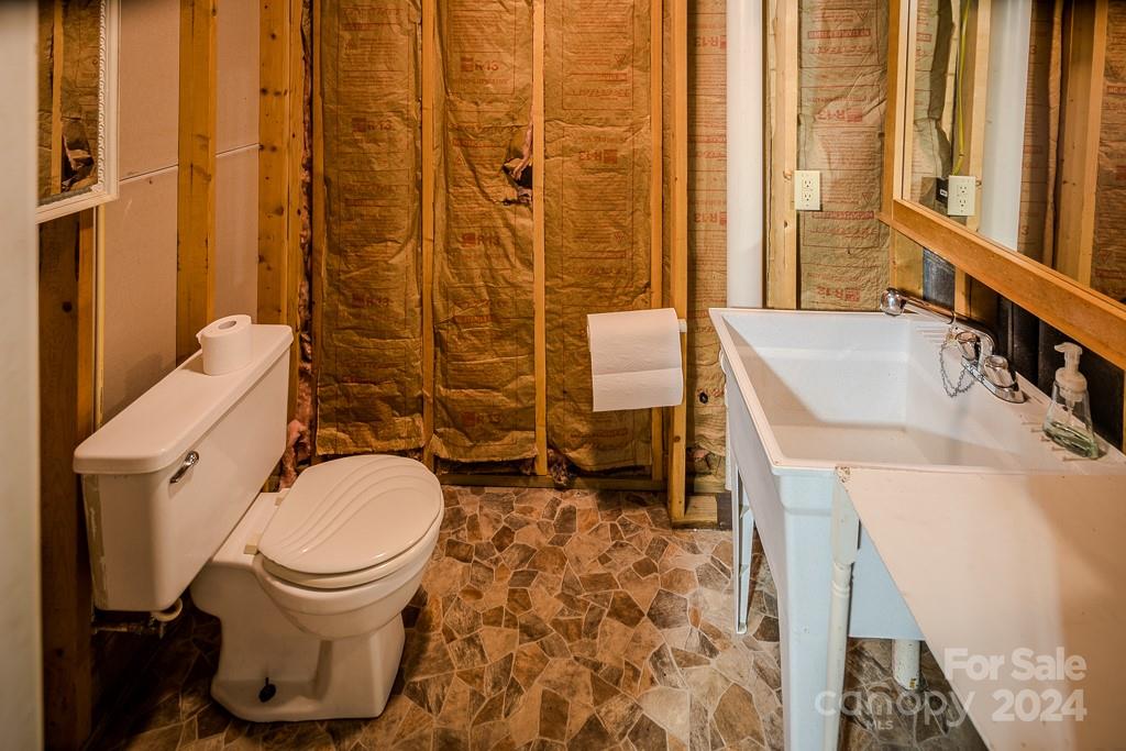 3346 Clarks Chapel Road Lenoir, NC 28645 - Photo 47 of 48 a bathroom with a sink toilet and shower