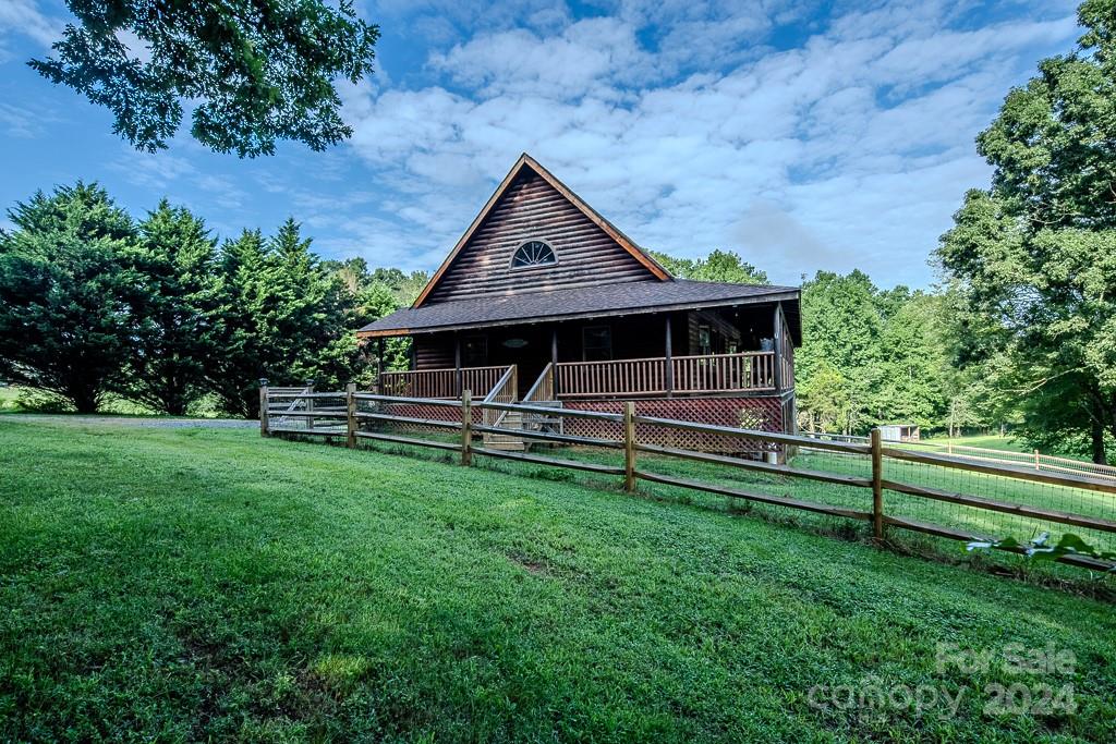 3346 Clarks Chapel Road Lenoir, NC 28645 - Photo 10 of 48 a house with trees in the background