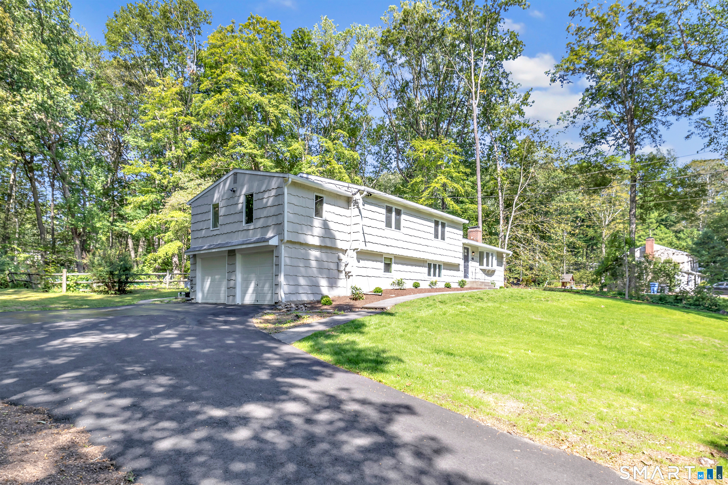 48 Crestwood Road Monroe, CT 06468 - Photo 3 of 32 a view of a big house with a big yard and large trees
