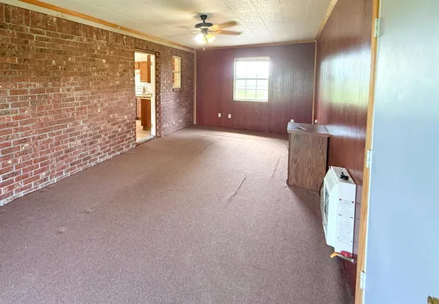 a view of a kitchen with furniture and a kitchen