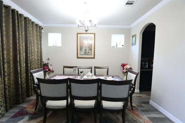 a dining room with furniture and window