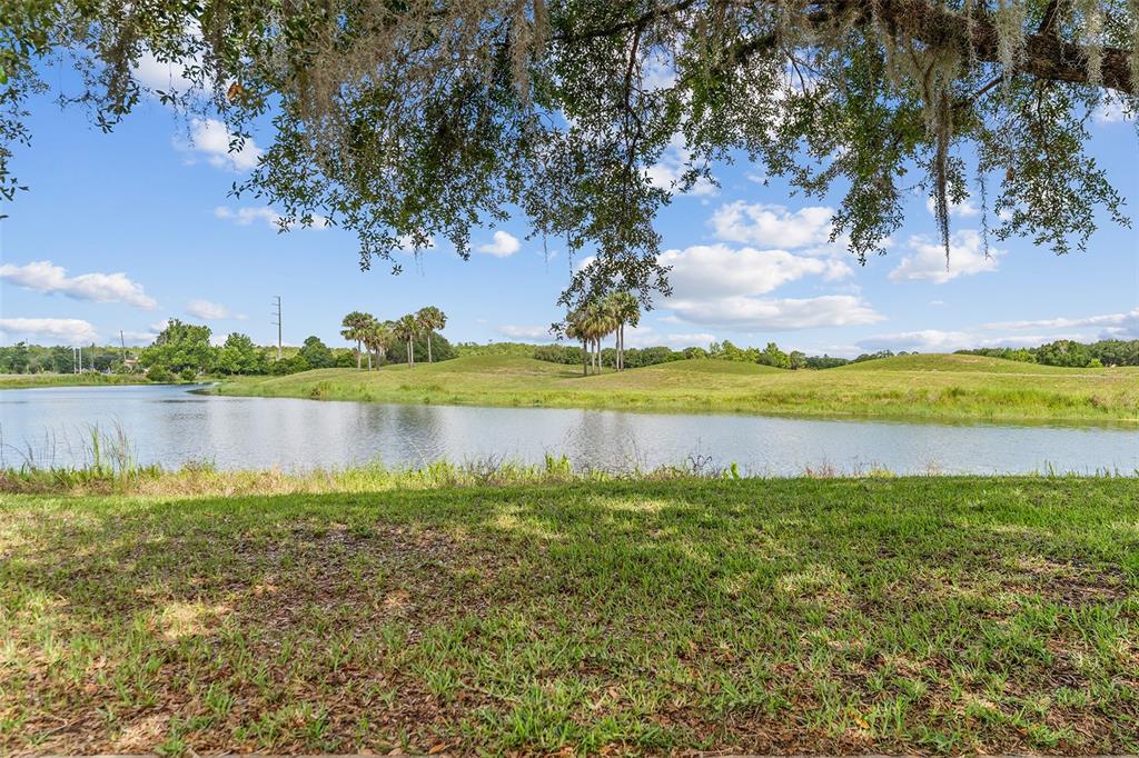 3523 Clay Brick Road St. Cloud, FL 34773 - Photo 4 of 62 a view of a lake with a big yard
