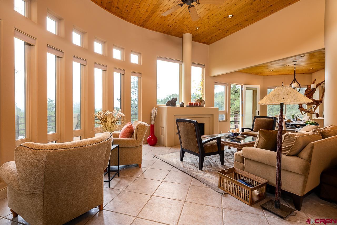 994 Cool Pines Drive Pagosa Springs, CO 81147 - Photo 11 of 35 a living room with furniture and a large window