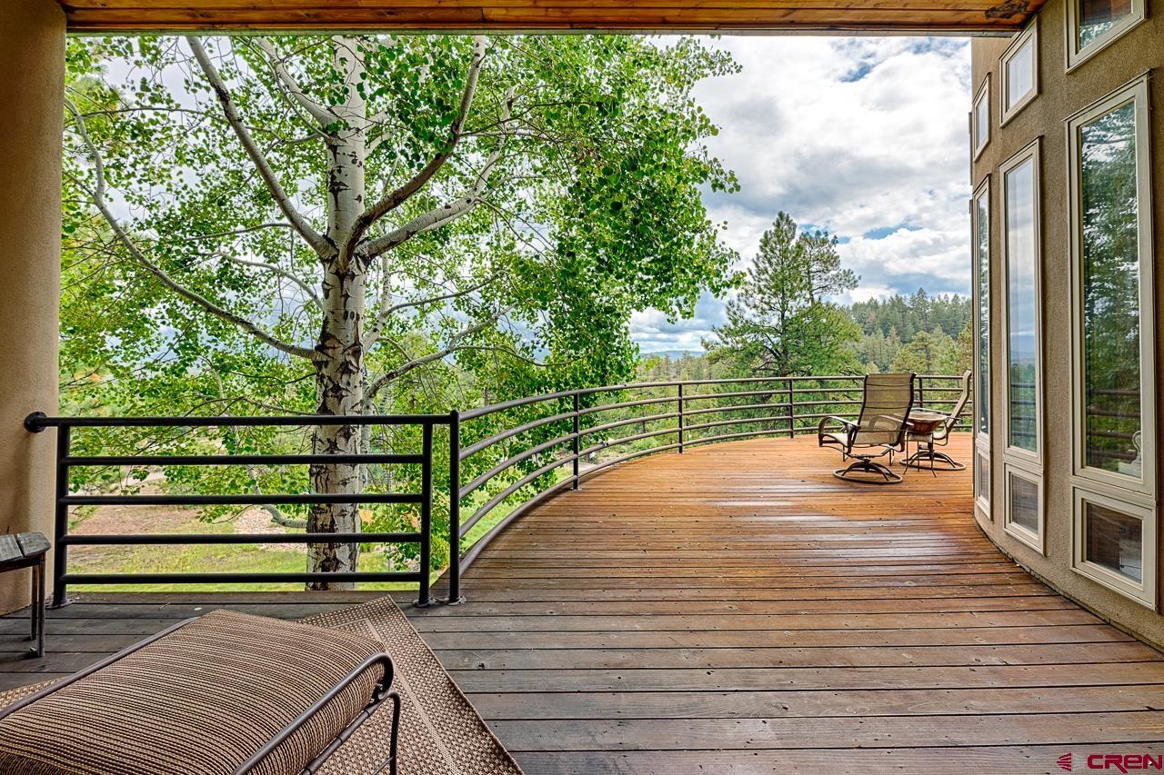 994 Cool Pines Drive Pagosa Springs, CO 81147 - Photo 14 of 35 a view of a balcony with lake view and wooden floor