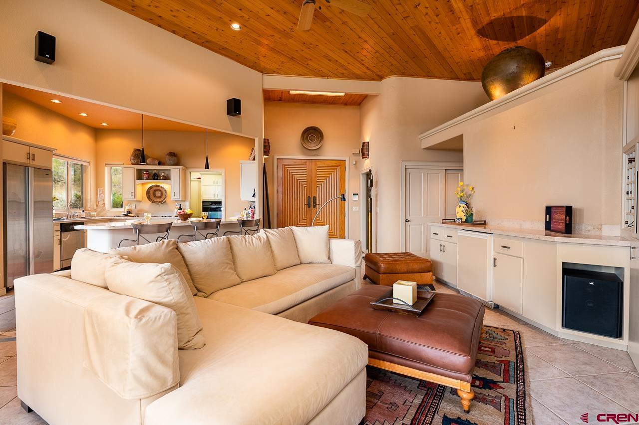 994 Cool Pines Drive Pagosa Springs, CO 81147 - Photo 16 of 35 a living room with furniture and a chandelier