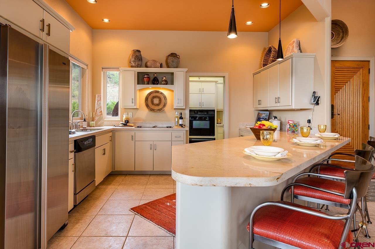 994 Cool Pines Drive Pagosa Springs, CO 81147 - Photo 18 of 35 a kitchen with cabinets and appliances