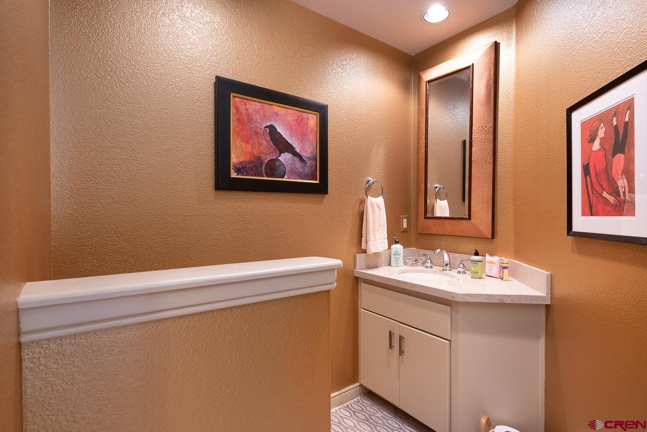 994 Cool Pines Drive Pagosa Springs, CO 81147 - Photo 19 of 35 a bathroom with a sink and a mirror