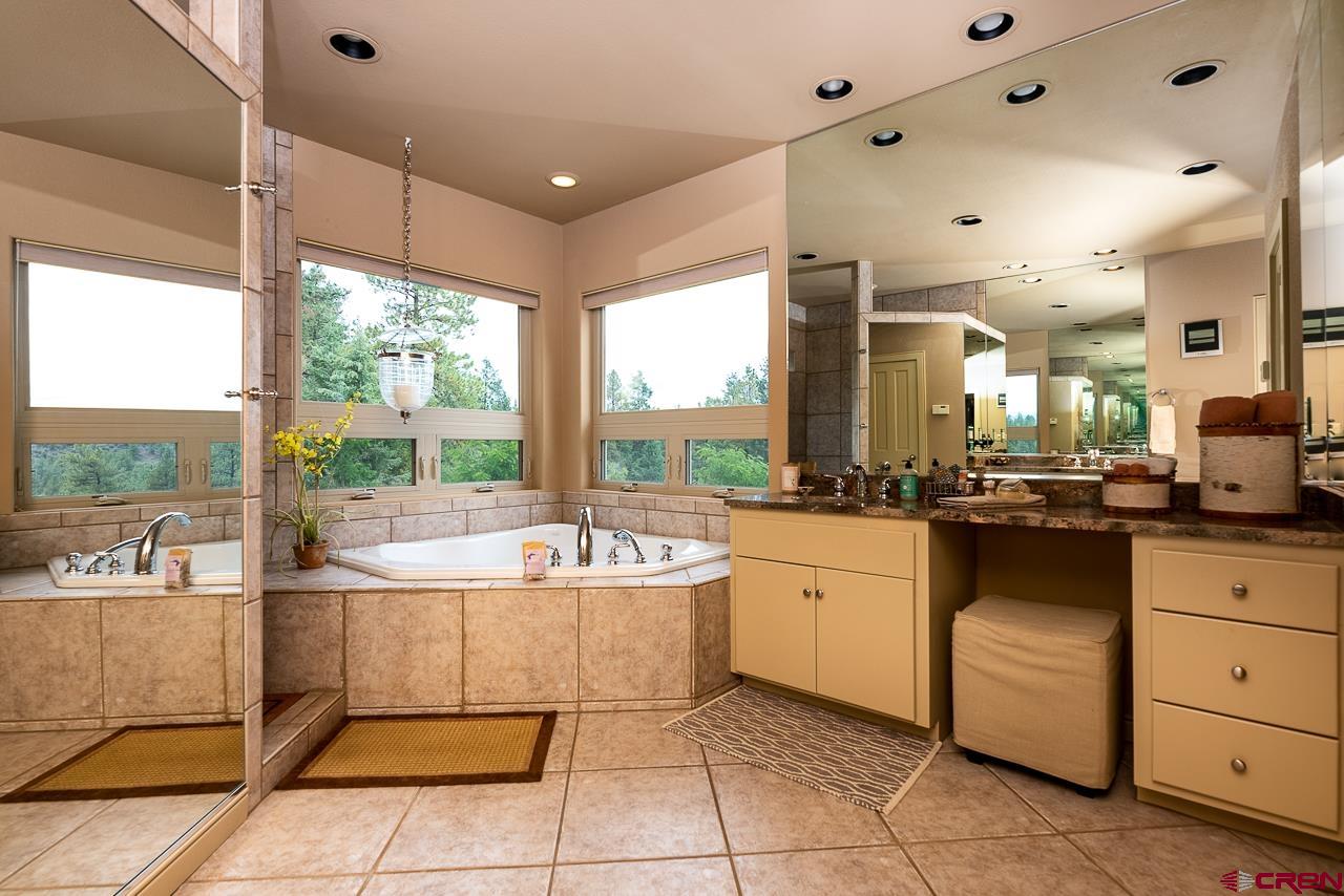 994 Cool Pines Drive Pagosa Springs, CO 81147 - Photo 25 of 35 a large white kitchen with a large window