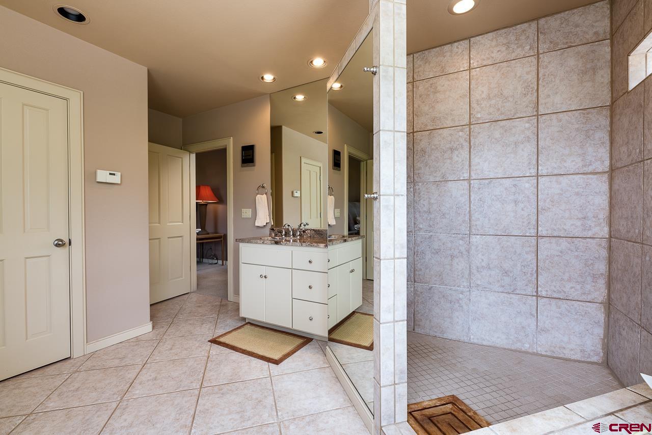 994 Cool Pines Drive Pagosa Springs, CO 81147 - Photo 26 of 35 a bathroom with a sink a toilet and shower