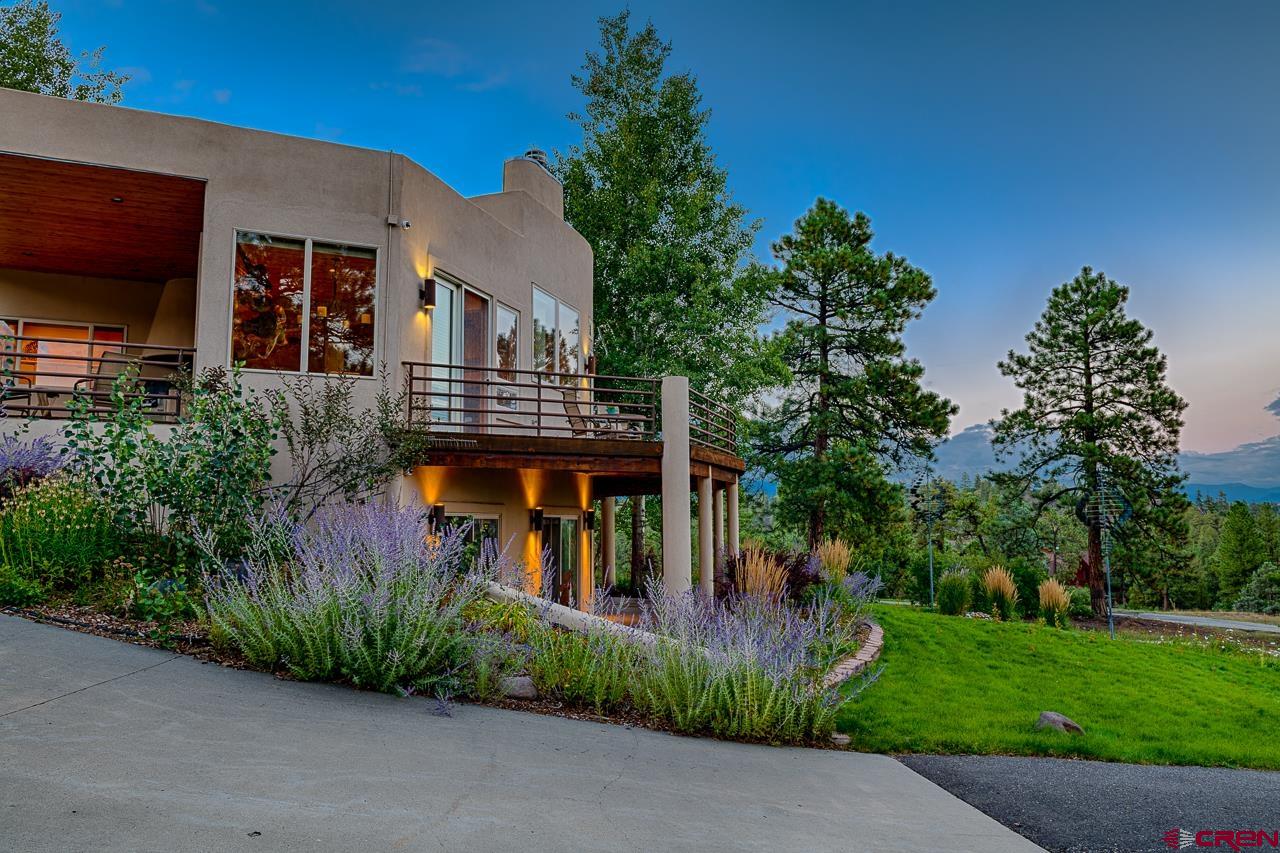 994 Cool Pines Drive Pagosa Springs, CO 81147 - Photo 6 of 35 a front view of a house with garden