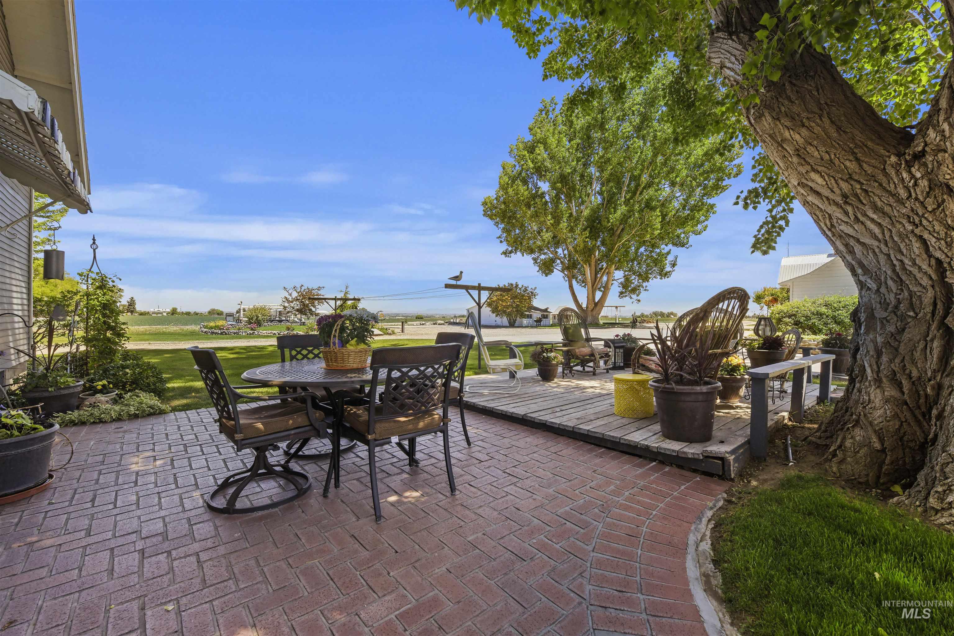 19234 Top Road Caldwell, ID 83607 - Photo 18 of 50 View of patio with outdoor dining space and a deck