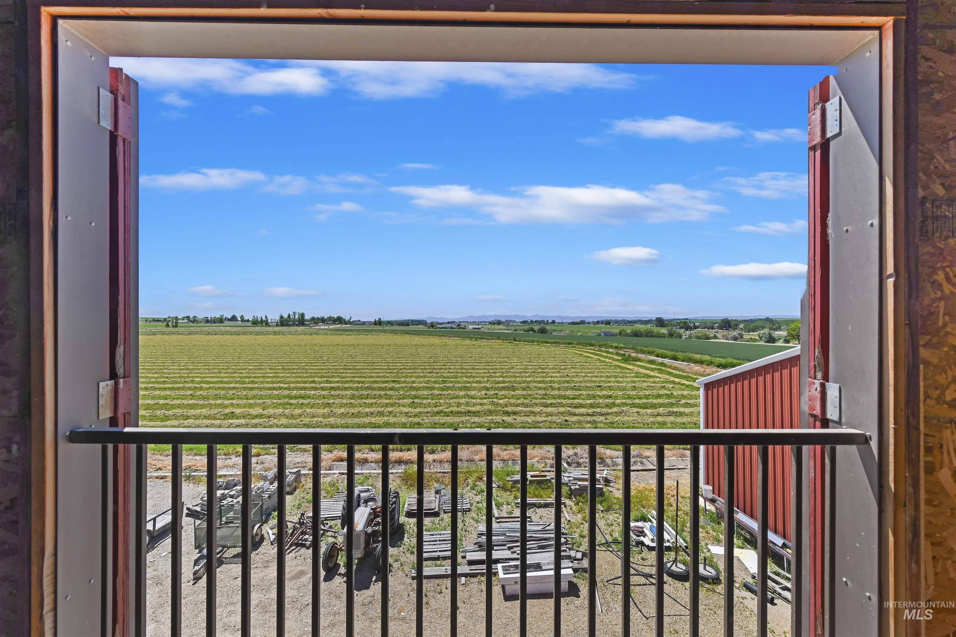 19234 Top Road Caldwell, ID 83607 - Photo 37 of 50 Balcony featuring agricultural area and a rural view