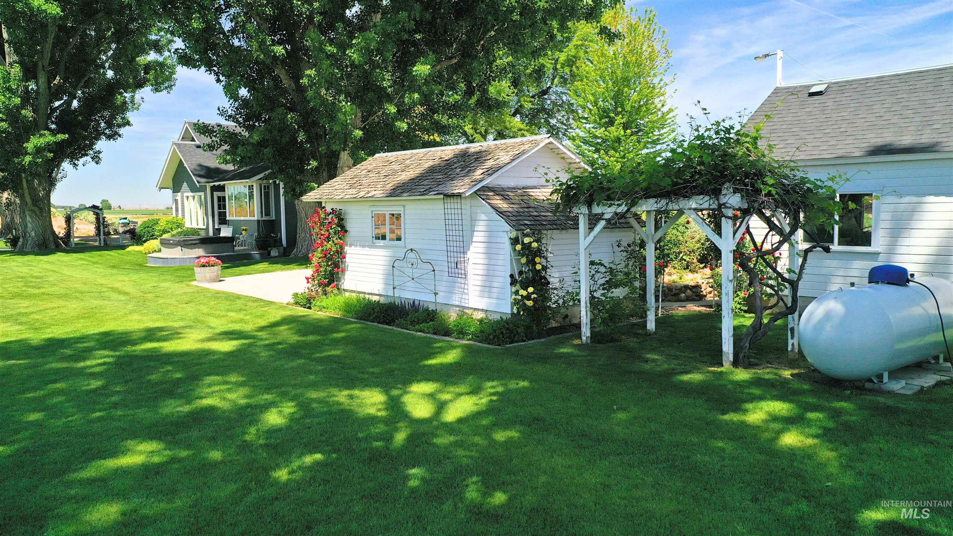 19234 Top Road Caldwell, ID 83607 - Photo 43 of 50 View of green lawn with an outbuilding