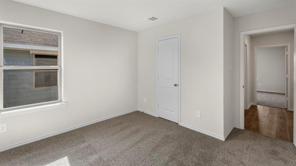 1969 Freeman Street Tyler, TX 75704 - Photo 22 of 30 Neutral-toned room with plush carpeting and a double-paned window