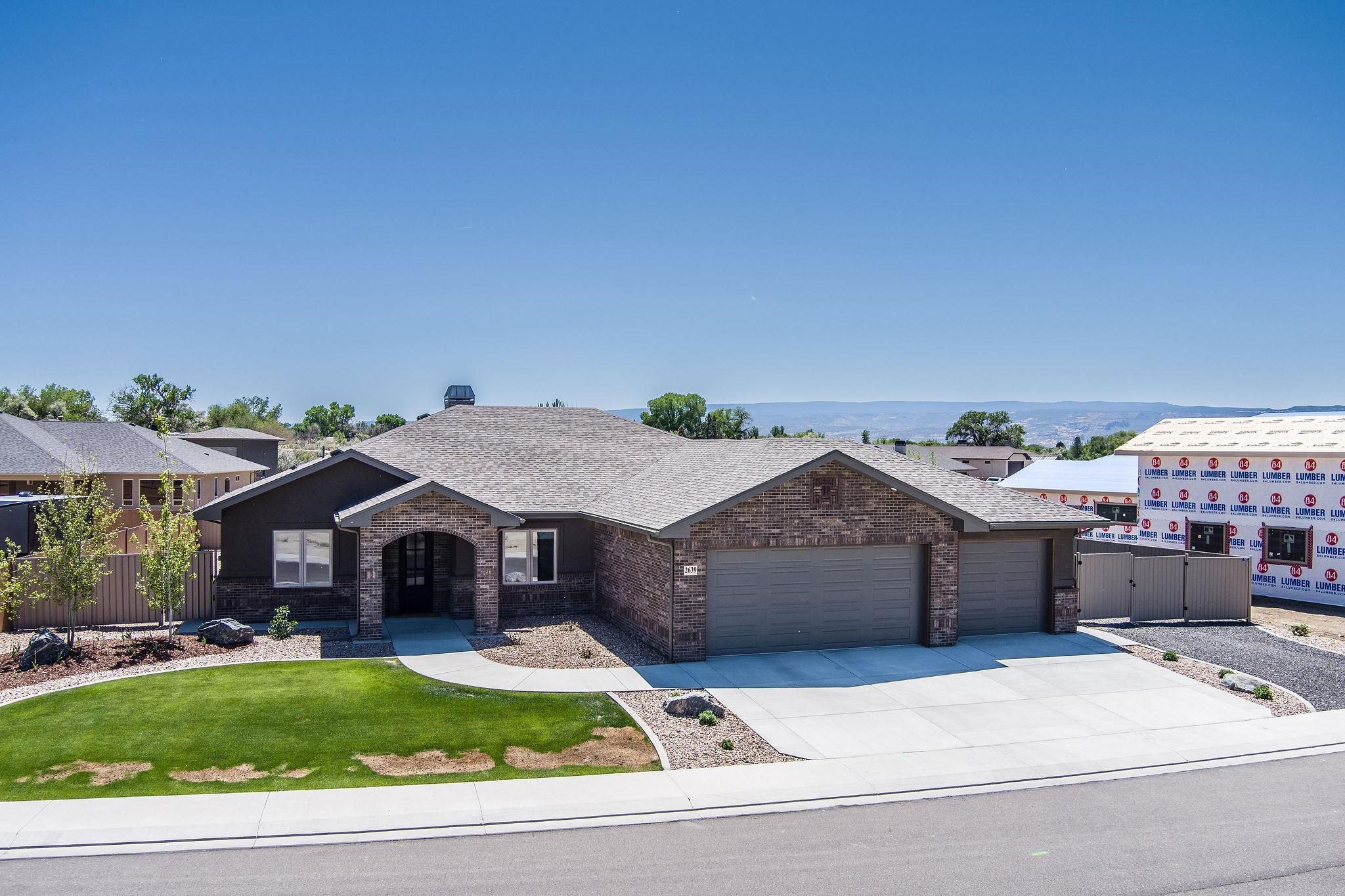 2639 Emerald Ridge Lane Grand Junction, CO 81506 - Photo 41 of 42 a aerial view of a house with a garden and pathway