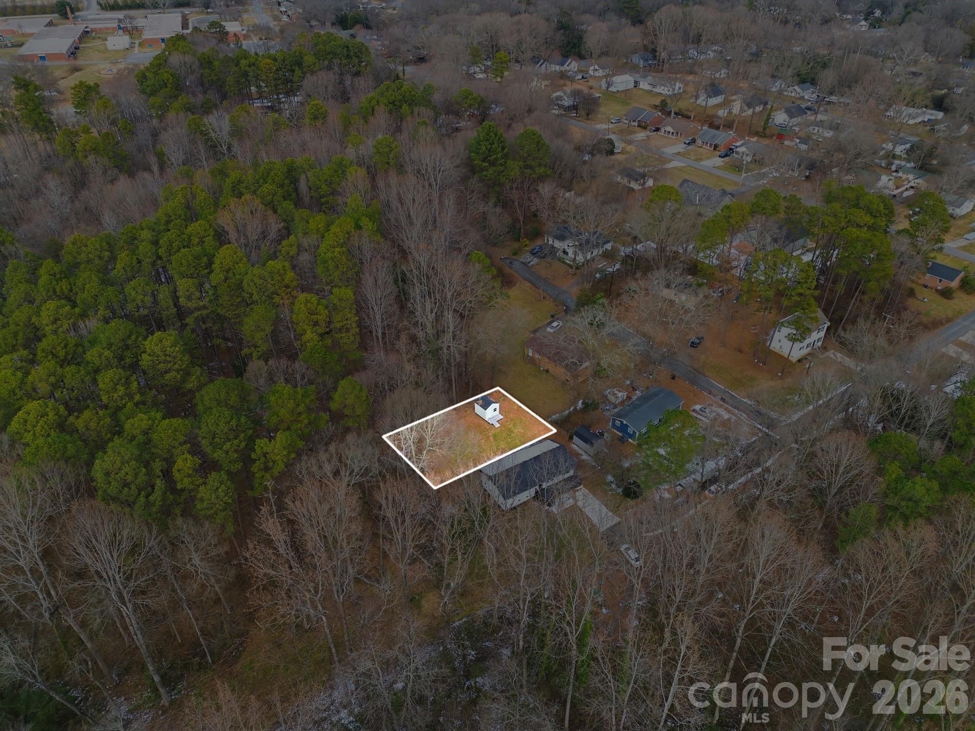 a aerial view of a house with a yard