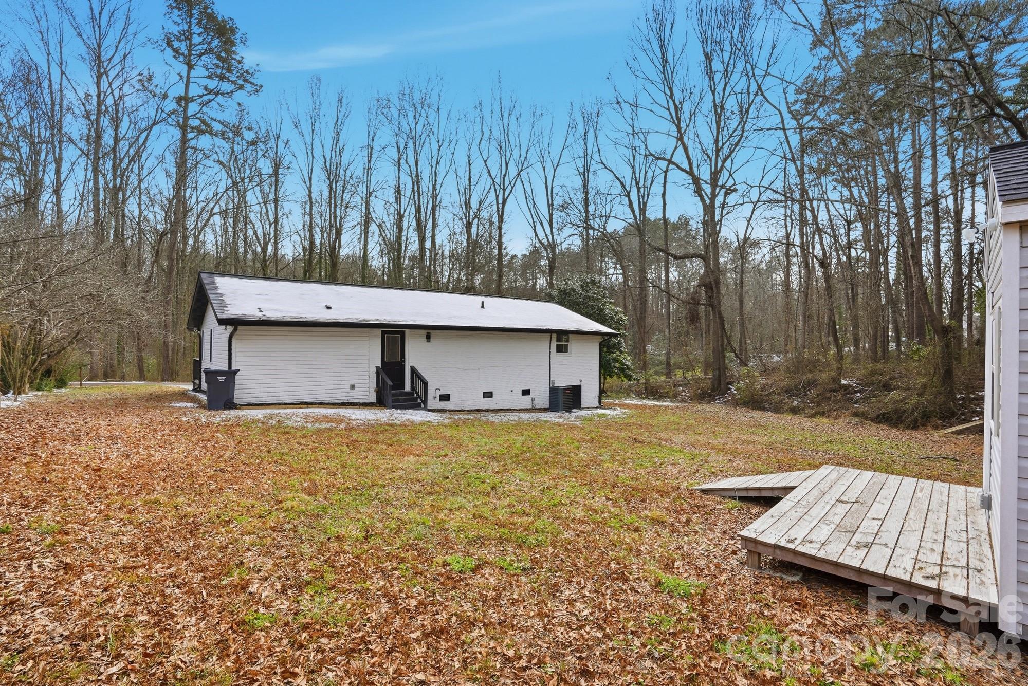 0 West Border Street Dallas, NC 28034 - Photo 9 of 21 a front view of a house with a yard and garage