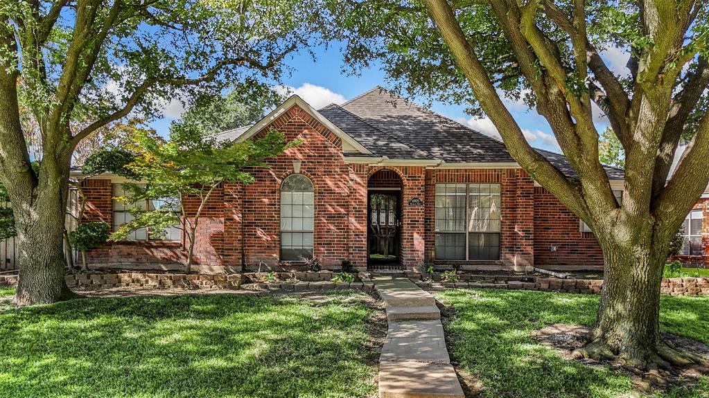 6905 Rochelle Drive Plano, TX 75023 - Photo 1 of 23 a view of a house with a tree in a yard