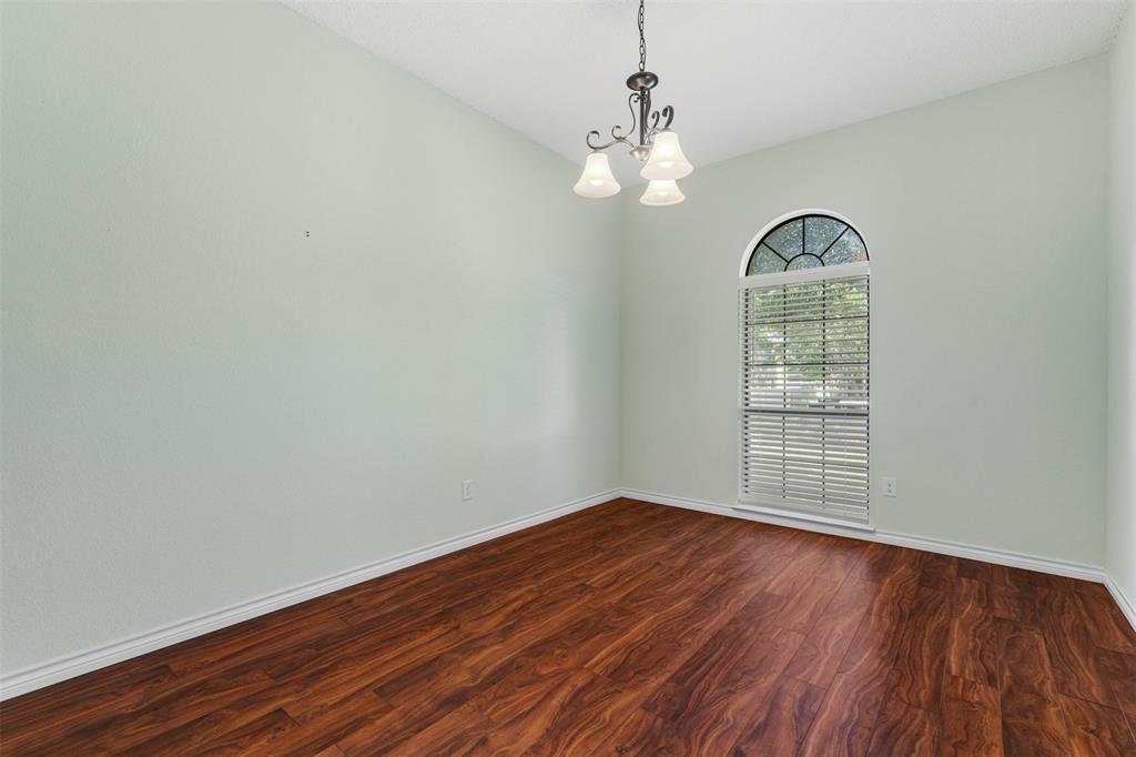 6905 Rochelle Drive Plano, TX 75023 - Photo 17 of 23 a view of empty room with wooden floor and fan