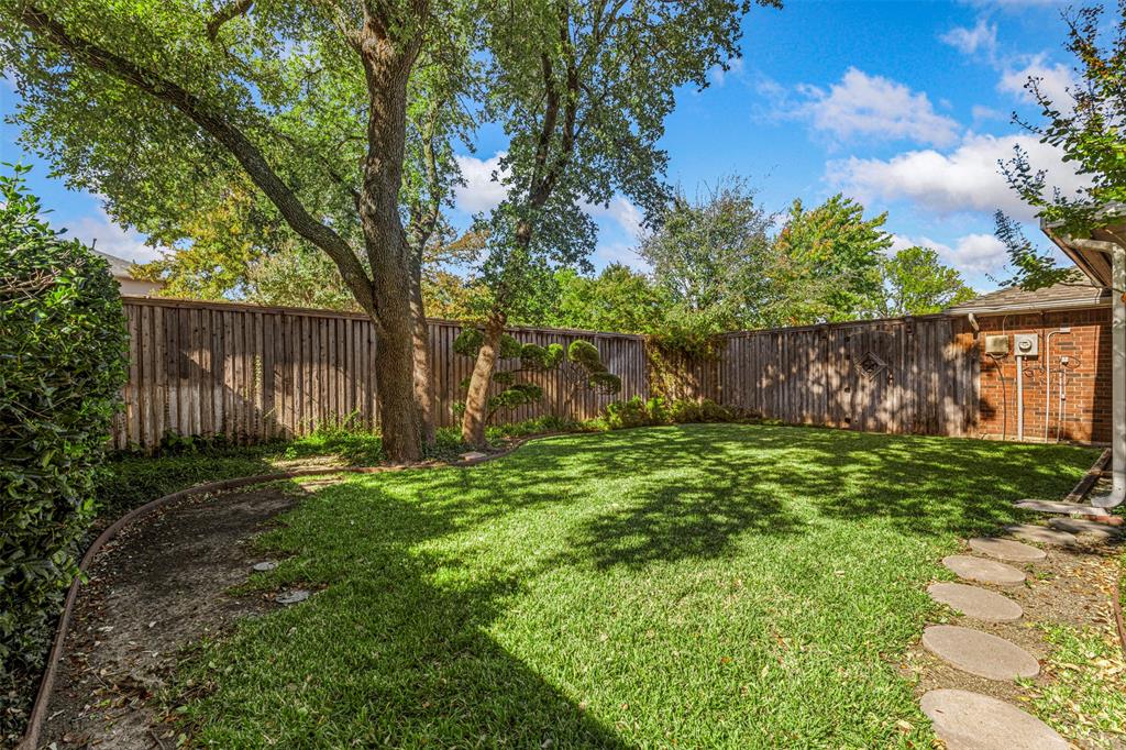 6905 Rochelle Drive Plano, TX 75023 - Photo 21 of 23 a backyard of a house with lots of green space