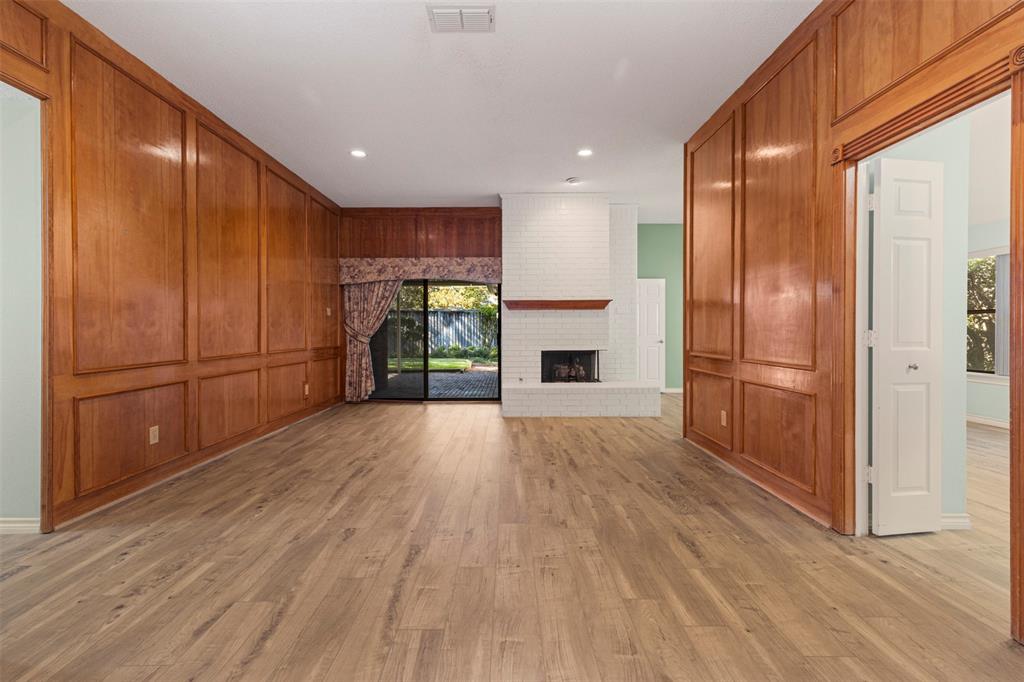 6905 Rochelle Drive Plano, TX 75023 - Photo 4 of 23 a view of empty room with wooden floor and electronic appliances