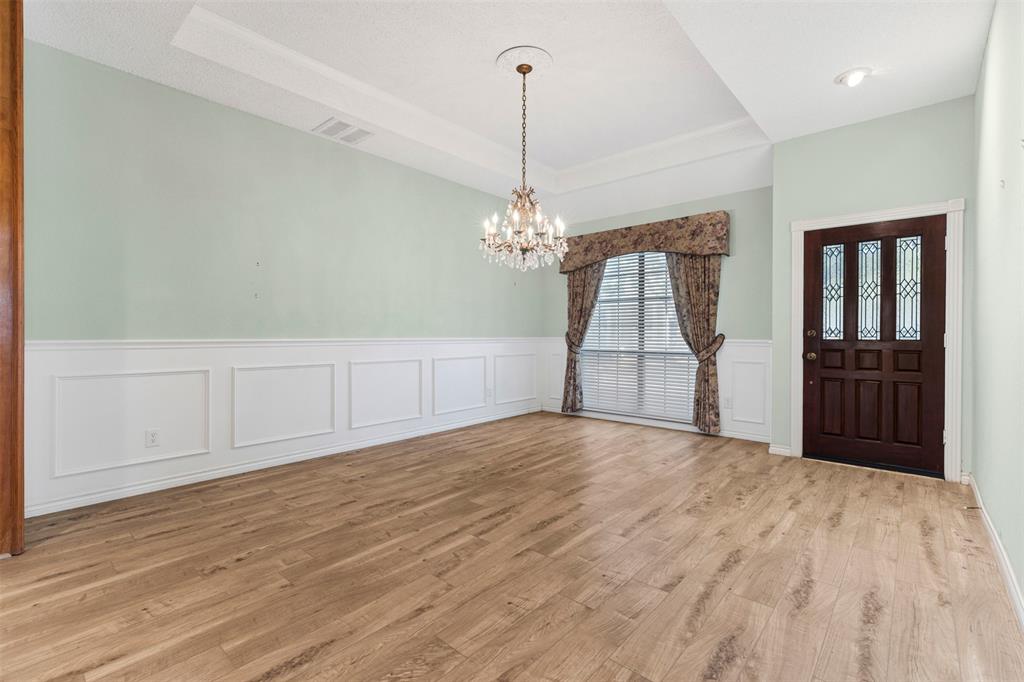 6905 Rochelle Drive Plano, TX 75023 - Photo 5 of 23 a view of a room with wooden floor and cabinet