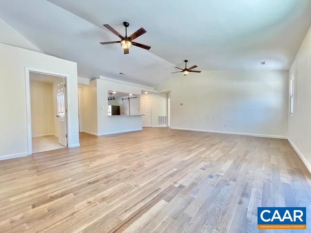6232 Howardsville Road Dillwyn, VA 23936 - Photo 14 of 35 wooden floor in an empty room with a ceiling fan