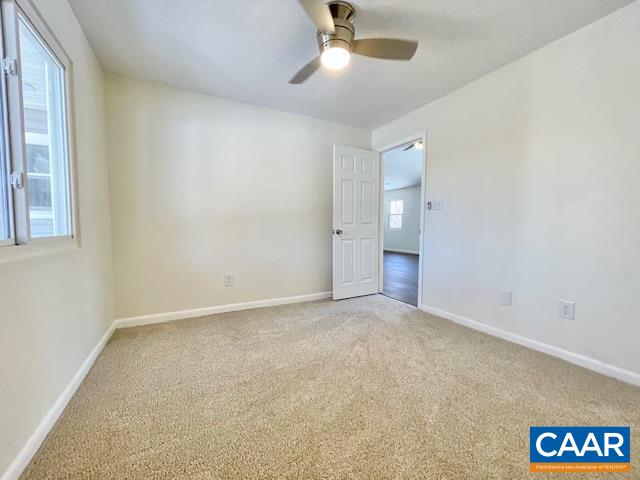 6232 Howardsville Road Dillwyn, VA 23936 - Photo 23 of 35 an empty room with windows and fan