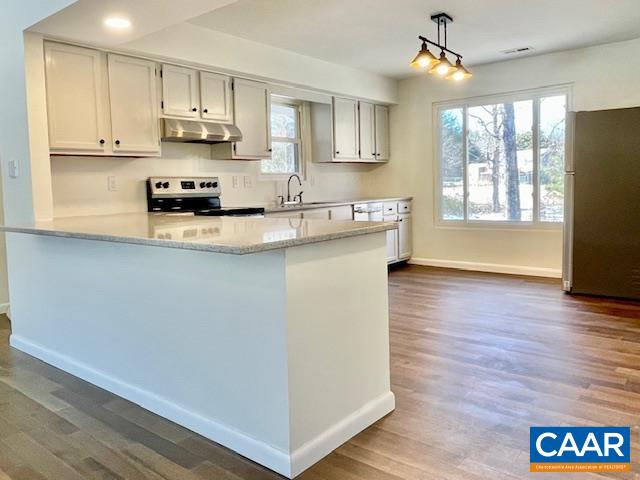 6232 Howardsville Road Dillwyn, VA 23936 - Photo 6 of 35 a kitchen with stainless steel appliances a stove a sink a refrigerator and cabinets