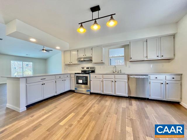 6232 Howardsville Road Dillwyn, VA 23936 - Photo 7 of 35 a large kitchen with cabinets and wooden floor