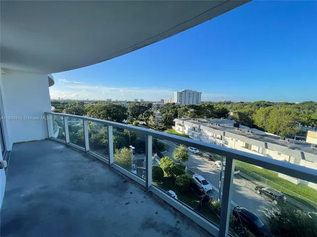 a view of a balcony with chairs