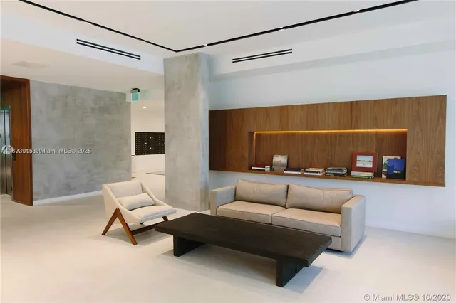 a view of a patio with a table and chairs