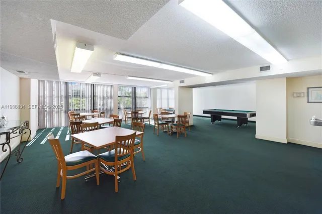 a dining room with furniture and a livingroom