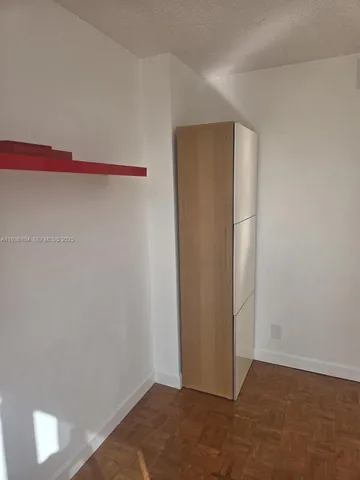 a view of an empty walk in closet