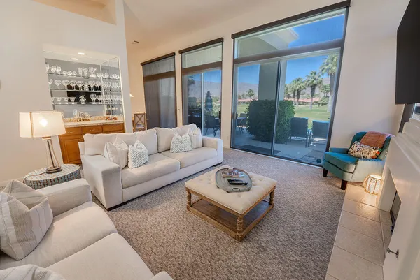 a living room with furniture and a rug