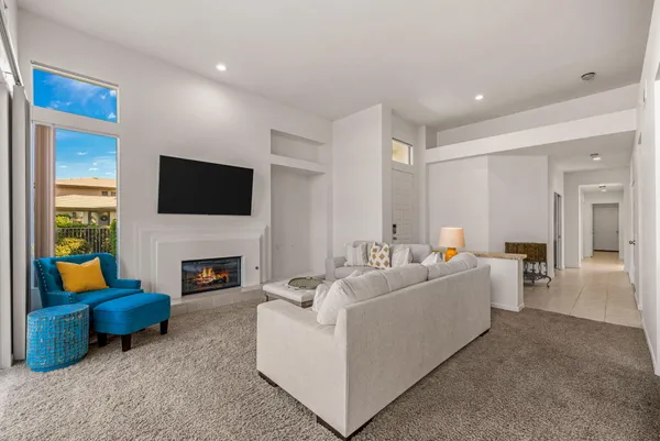 a living room with furniture and a fireplace