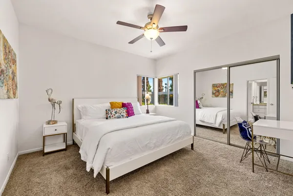 a bedroom with a bed and window